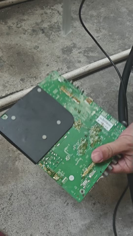 Aiolith AI10 Micro dry ice blaster cleaning a PCB circuit board during a precision electronics cleaning demonstration.