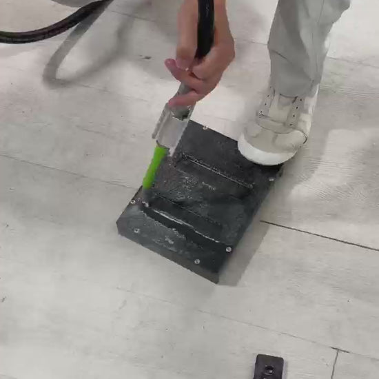 Aiolith AI10 Micro portable dry ice blasting machine cleaning a metal surface