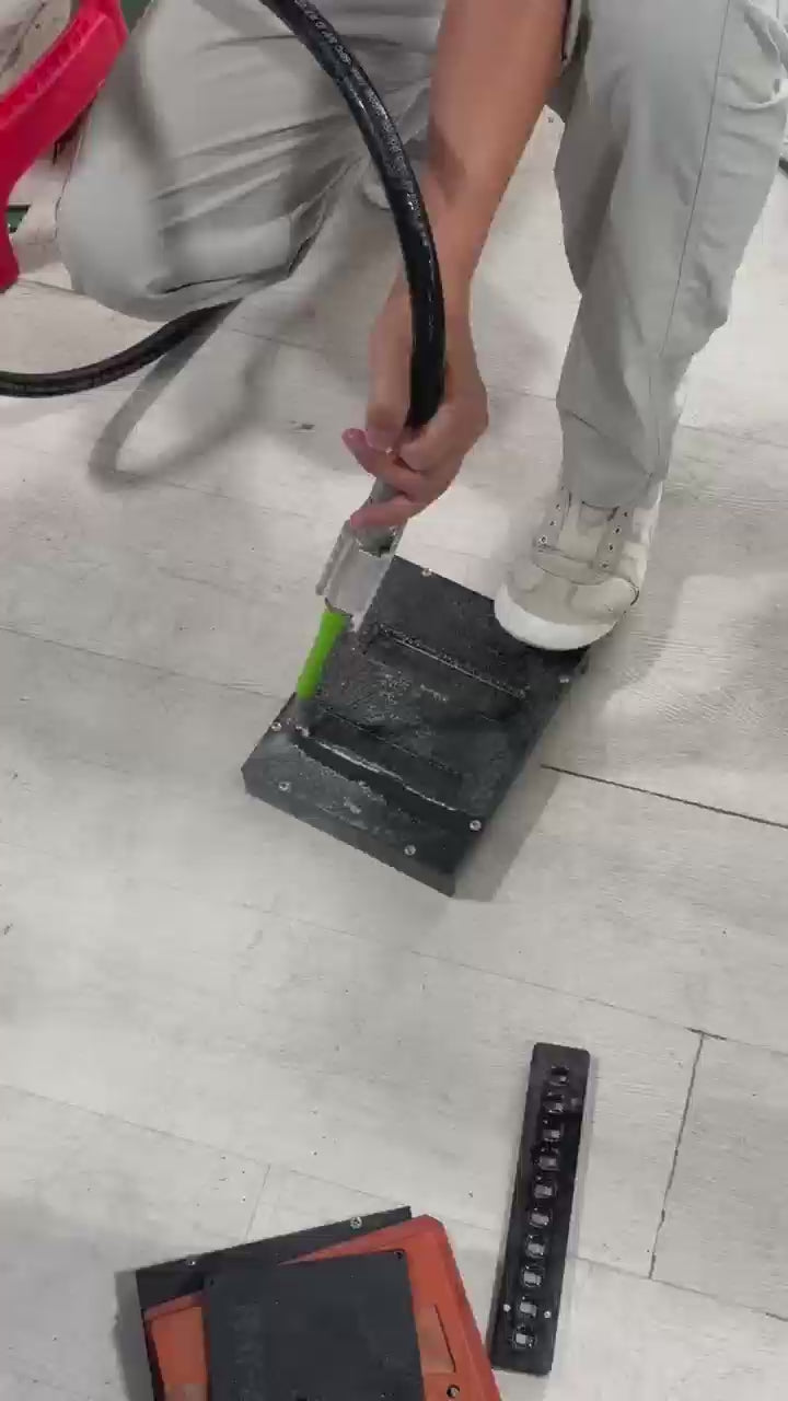 Aiolith AI10 Micro portable dry ice blasting machine cleaning a metal surface